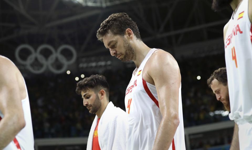 Spain's Ricky Rubio (left) and Pau Gasol walk off the court following their loss to Brazil at the 2016 Summer Olympics in Rio de Janeiro, Brazil, on Tuesday, Aug. 9, 2016. (AP/Eric Gay)