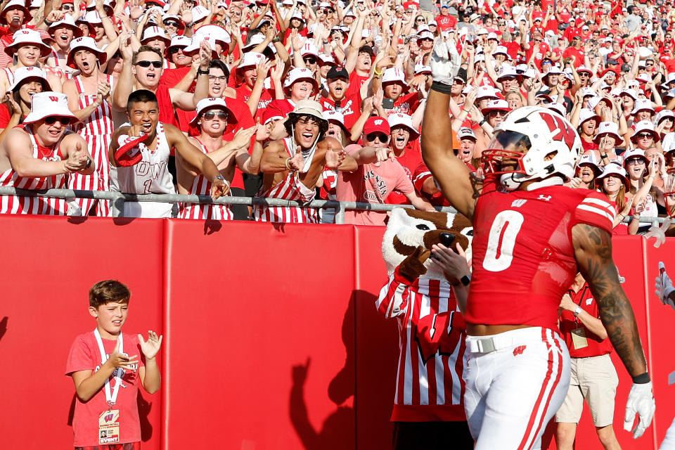 Braelon Allen #0 of the Wisconsin Badgers celebrates his 22 yard touchdown run in the fourth quarter against the <a class="link " href="https://sports.yahoo.com/ncaaf/teams/buffalo/" data-i13n="sec:content-canvas;subsec:anchor_text;elm:context_link" data-ylk="slk:Buffalo Bulls;sec:content-canvas;subsec:anchor_text;elm:context_link;itc:0">Buffalo Bulls</a> at Camp Randall Stadium on Sept. 2, 2023 in Madison, Wisconsin. John Fisher/Getty Images