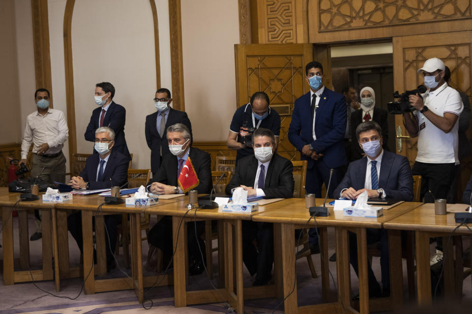 Turkish Foreign Ministry Deputy Sedat Onal, seated second right, meets with Hamdi Sanad Loza, Egyptian deputy foreign minister at the foreign ministry in Cairo, Egypt, Wednesday, May 5, 2021. (AP Photo/Nariman El-Mofty)