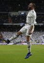 Real Madrid's Dani Carvajal, left, celebrates after Valencia's Daniel Wass scored an own goal during a Spanish La Liga soccer match between Real Madrid and Valencia at the Santiago Bernabeu stadium in Madrid, Spain, Saturday, Dec. 1, 2018. (AP Photo/Paul White)