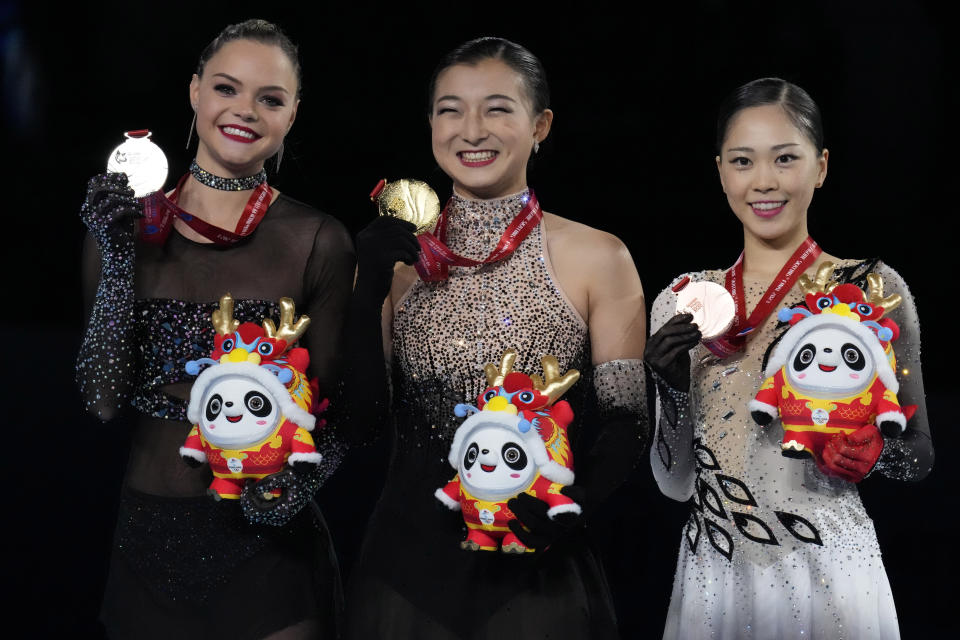 From left silver medalist Belgium's Loena Hendrickx, gold medalist Japan's Kaori Sakamoto and bronze medalist Japan's Hana Yoshida pose for photos during the victory ceremony for the Women's Final in the ISU Grand Prix of Figure Skating Final held in Beijing, Saturday, Dec. 9, 2023. (AP Photo/Ng Han Guan)