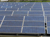 Solar panels from a smaller pilot project are shown, Tuesday, June 6, 2023, a water treatment plant in Millburn, N.J., where a larger array of floating solar panels provides enough electricity to power 95% of the treatment facilities electrical needs. (AP Photo/Wayne Parry)