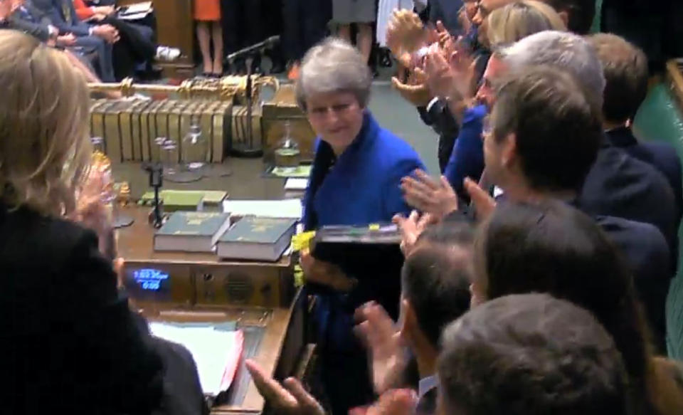 MPs applaud as Prime Minister Theresa May leaves following her final Prime Minister's Questions in the House of Commons, London.