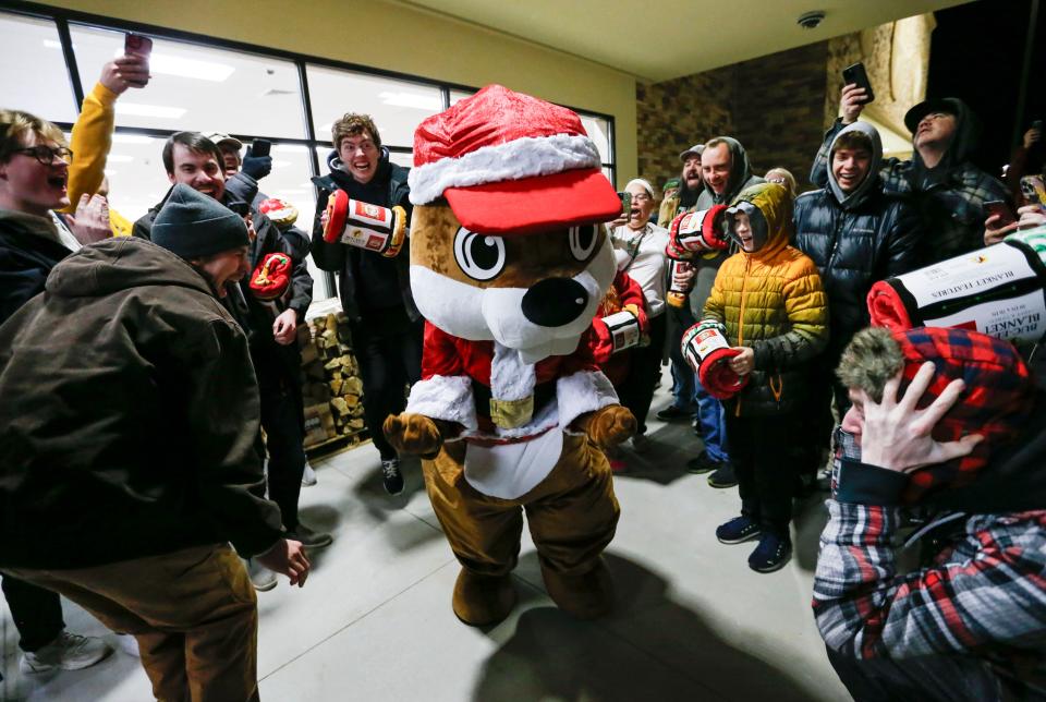 The Buc-ee's Beaver mascot dances with a group of Buc-ee's fan outside the store before Missouri's first Buc-ee's opened on Monday, Dec. 11, 2023.