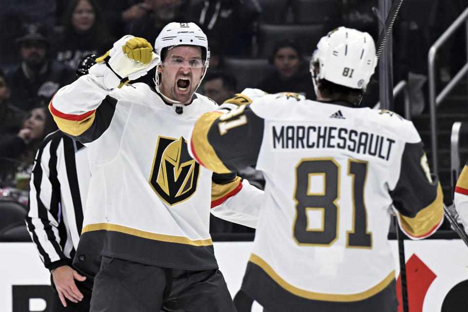 Vegas Golden Knights right wing Mark Stone, left, celebrates his goal against the Los Angeles Kings with right wing Jonathan Marchessault during the third period of an NHL hockey game in Los Angeles, Saturday, Oct. 28, 2023. (AP Photo/Alex Gallardo)