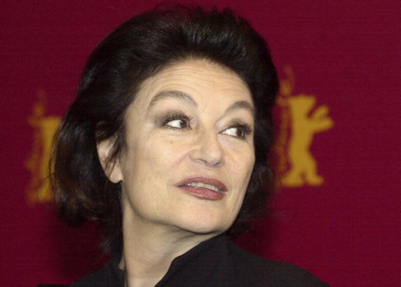 FILE - French actress Anouk Aimee is seen prior to a media conference at the 53rd Berlinale Film Festival in Berlin Thursday, Feb. 13, 2003. Later this evening she will be honored with a Golden Bear award for her lifetime achievements. French actress Anouk Aimée, winner of a Golden Globe for her starring role in "A Man and a Woman" by legendary French director Claude Lelouch, has died, her agent said Tuesday. She was 92. (AP Photo/Sven Kaestner, File)