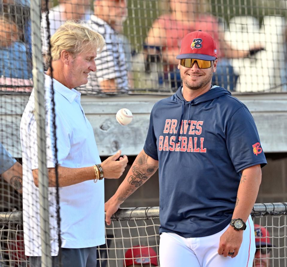 Former Boston Red Sox player Steve Lyons (left) and catcher and current assistant Bourne coach Jarrod Saltalamacchia share a moment before the Bourne game with Falmouth in Bourne in Aug. 4, 2022. Lyons threw out the ceremonial first pitch. (Photo: Ron Schloerb/Cape Cod Times)