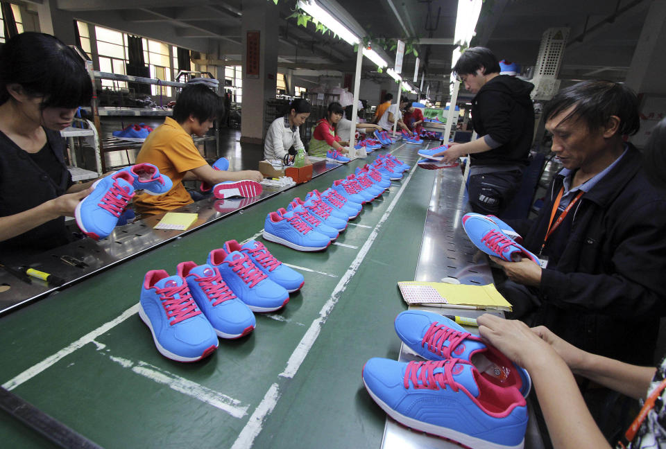 Chinese workers manufacture sports shoes at a shoe factory in Jinjiang in southeast China's Fujian province Friday Nov. 9, 2012. China's auto sales, consumer spending and factory output improved in October in a new sign of economic recovery as the Communist Party prepared to install a new generation of leaders. Growth in factory output accelerated to 9.6 percent over a year earlier from the previous month's 9.2 percent, the government reported Friday. (AP Photo) CHINA OUT