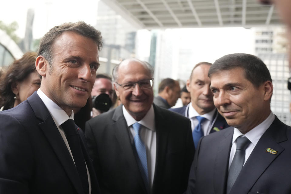 French President Emmanuel Macron, from left, Brazil's Vice President Geraldo Alckmin and the President of Industries Federation Josue Gomes, pose for a photo before the start of a meeting with the business community, at the Sao Paulo State Industries Federation, in Sao Paulo, Brazil, Wednesday, March 27, 2024. Macron is on a three-day official visit to Brazil. (AP Photo/Andre Penner)