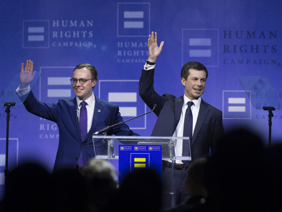 Democratic presidential candidate Pete Buttigieg, right, and husband Chasten Glezman Buttigieg wave to the crowd during the Human Rights Campaign's 14th Annual Las Vegas Gala dinner at Caesars Palace, Saturday, May 11, 2019, in Las Vegas. (Benjamin Hager/Las Vegas Review-Journal via AP)