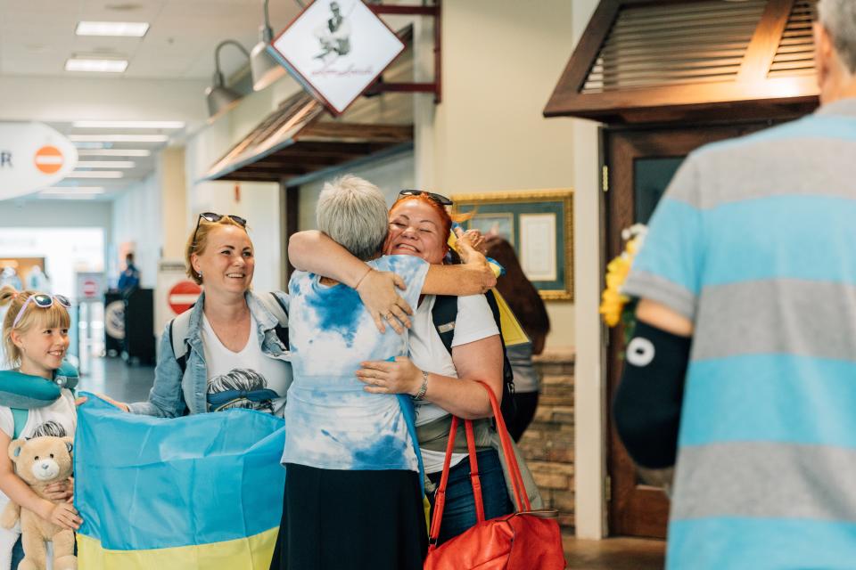 Liudmyla Rybak hugs Elizabeth Langland upon Rybak's arrival in Florida. Langland is sponsoring Rybak's family through the Uniting for Ukraine refugee program.