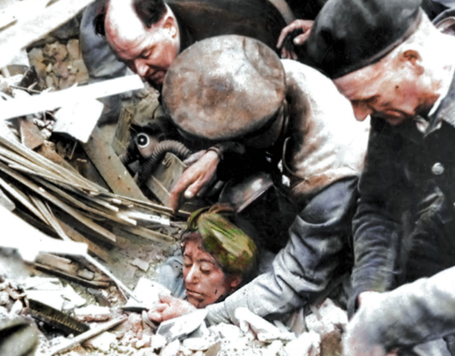 <p>A woman is rescued from the rubble after a V2 attack in Manor Park, East London. (MediaDrumWorld) </p>