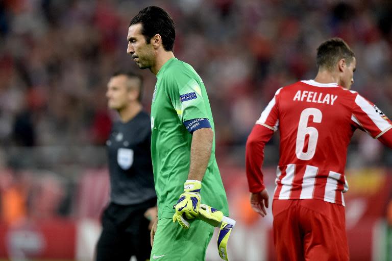 Juventus goalkeeper Gianluigi Buffon trudges off after his team loses 1-0 to Olympiacos in their Group A Champions League clash in Athenson October 22, 2014