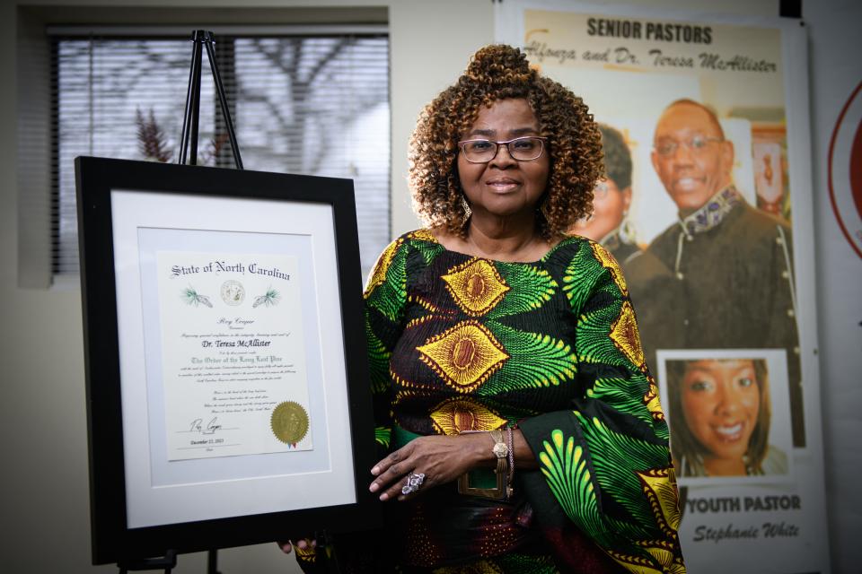 Dr. Teresa McAllister stands with the Order of the Long Leaf Pine award, which she was awarded in January.