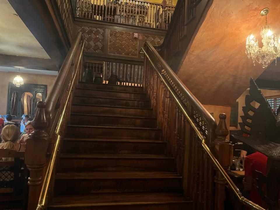 staircase to the second floor at yak and yeti restaurant in animal kingdom