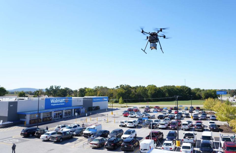 A DroneUp drone hovers above a Walmart location in Farmington City, Utah. Walmart is offering deliveries by drone in seven states, including Florida.