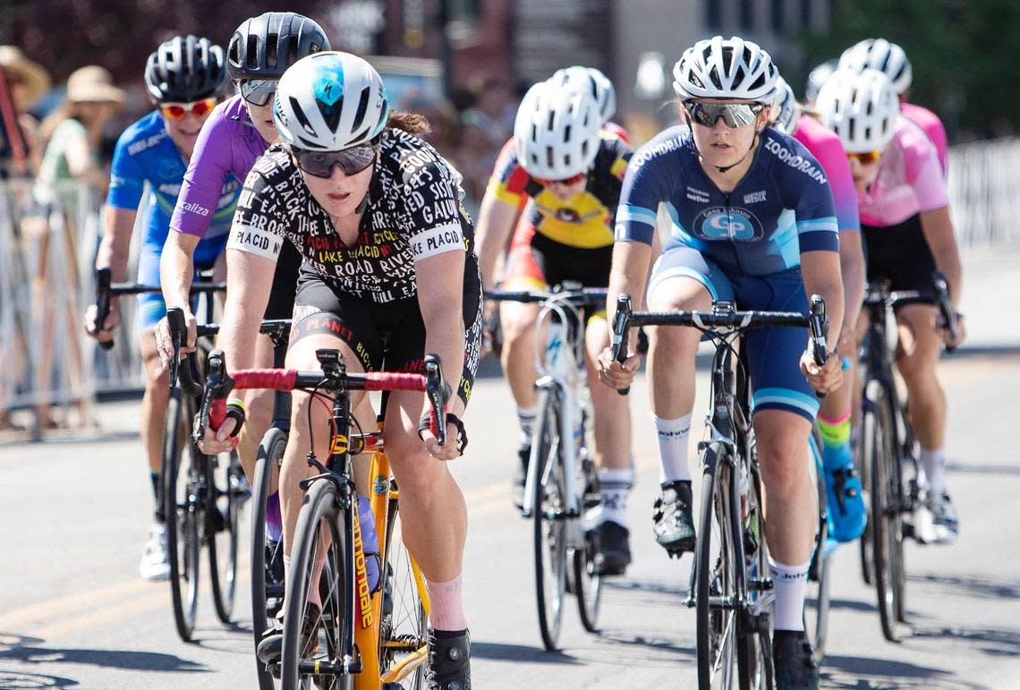 Cecily Decker, left, competes in the women’s Cat 2-3-4 race during the Twilight Criterium in downtown Boise on Saturday.