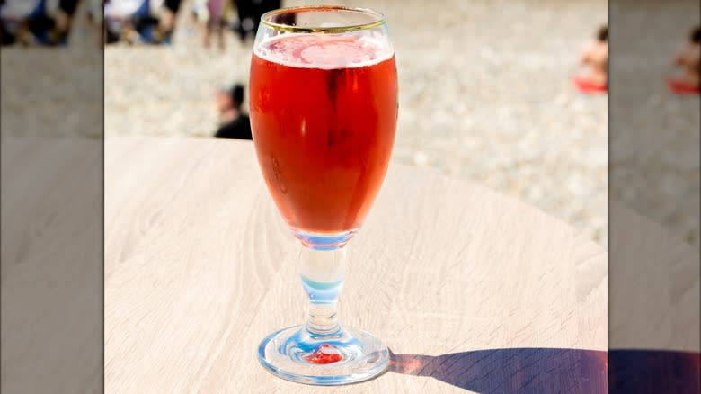 A Queen Mary beer and grenadine cocktail in a glass