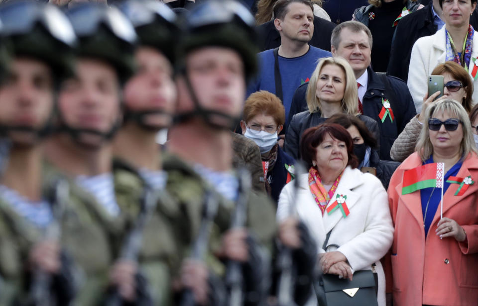 People attend the Victory Day military parade that marked the 75th anniversary of the allied victory over Nazi Germany, in Minsk, Belarus, Saturday, May 9, 2020. Belarus remains one of the few countries that hadn't imposed a lockdown or restricted public events despite recommendations of the World Health Organization. (AP Photo/Sergei Grits)