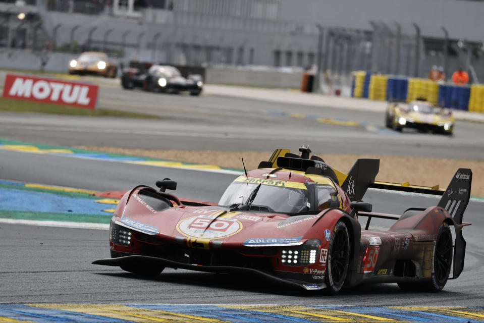 The Ferrari Corse team car driven by Italy's Antonio Fuoco, Spain's Miguel Molina and Denmark's Nicklas Nielsen takes a curve during the 24-hour Le Mans endurance race in Le Mans, western France, Sunday, June 16, 2024. (AP Photo/Jeremias Gonzalez)