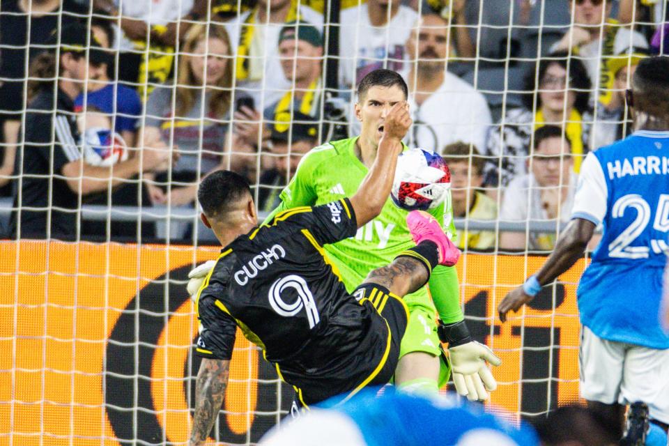 June 3, 2023;  Columbus, Ohio, USA;  Columbus Crew forward Cucho Hernandez (9) kicks the ball and scores a goal while Charlotte FC defender Harrison Afful (25) defends in the first half at Lower.com Field.  Mandatory Credit: Trevor Ruszkowski-USA TODAY Sports