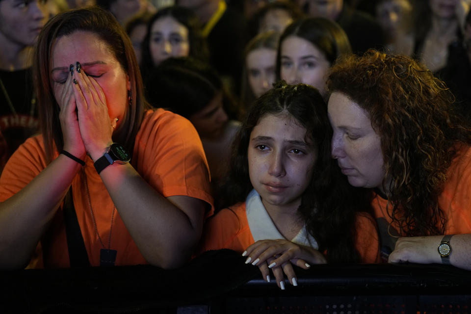 Relatives and friends of hostages held in the Gaza Strip by the Hamas militant group call for their release in the Hostages Square at the Museum of Art in Tel Aviv, Israel, Saturday Dec. 2, 2023. (AP Photo/Ariel Schalit))