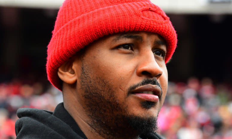 Carmelo Anthony wearing a red beanie.