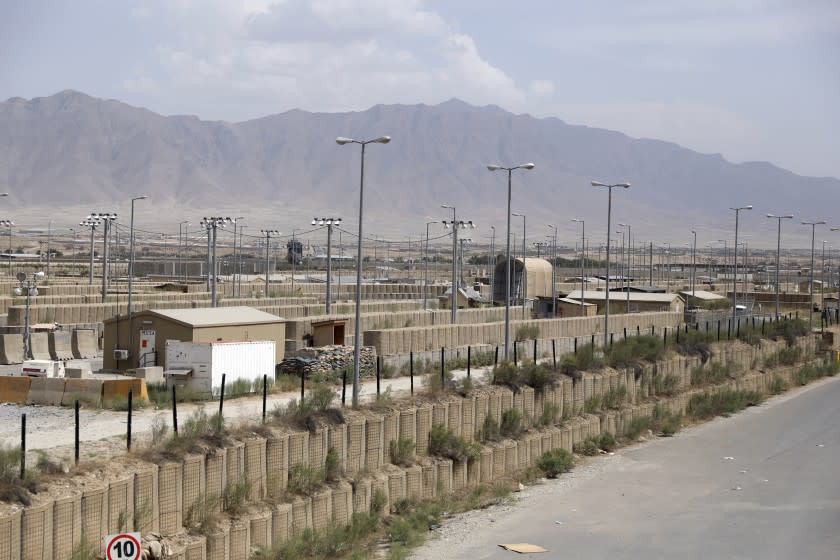 Blast wallls and a few buildings can be seen at the Bagram air base after the American military left the base, in Parwan province north of Kabul, Afghanistan, Monday, July 5, 2021. The U.S. left Afghanistan's Bagram Airfield after nearly 20 years, winding up its "forever war," in the night, without notifying the new Afghan commander until more than two hours after they slipped away. (AP Photo/Rahmat Gul)