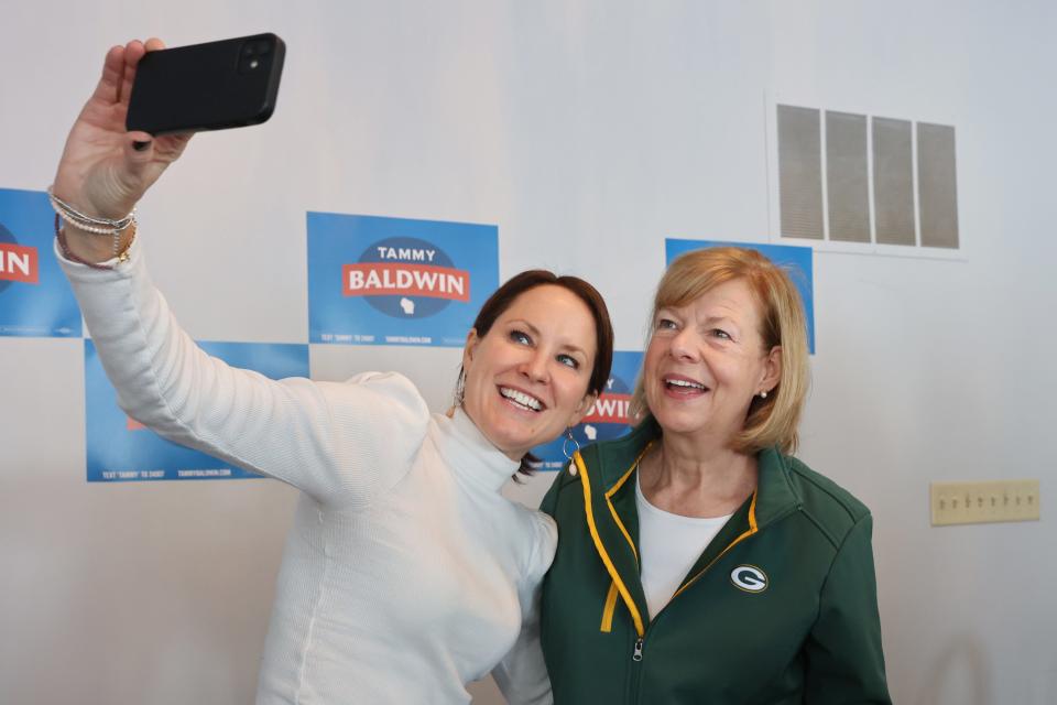 Democratic Sen. Tammy Baldwin takes a selfie with a supporter from Motherhood For Good. Baldwin met with Waukesha-area moms and Lt. Gov. Sara Rodriguez to discuss and answer questions at a campaign event in Brookfield, Wisconsin, on Jan. 14, 2024.