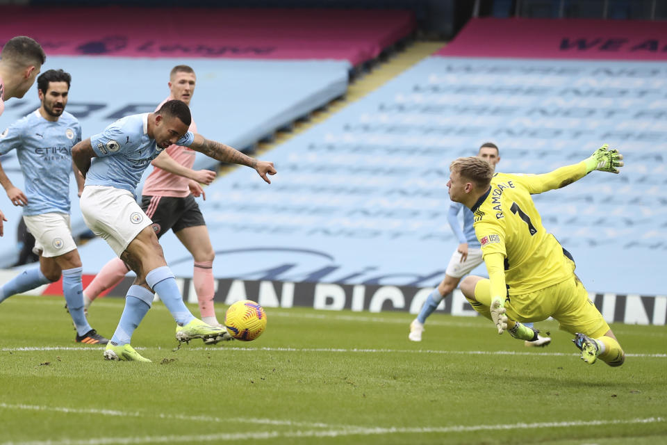 Manchester City's Gabriel Jesus scores his side's opening goal during the English Premier League match between Manchester City and Sheffield United at the the City of Manchester Stadium in Manchester, England, Saturday, Jan. 30, 2021. (Martin Rickett/Pool via AP)