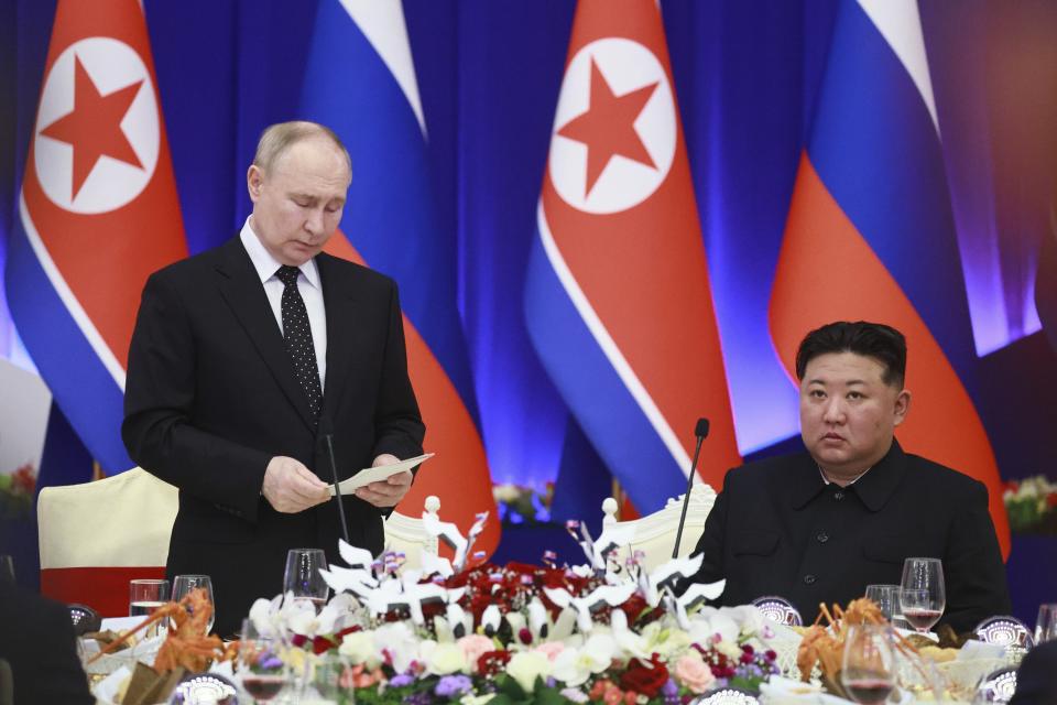 Russian President Vladimir Putin, left, speaks as North Korea's leader Kim Jong Un listens to him during a State Reception after their talks in Pyongyang, North Korea, on Wednesday, June 19, 2024. (Vladimir Smirnov, Sputnik, Kremlin Pool Photo via AP)