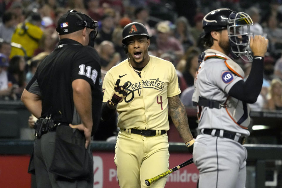 Arizona Diamondbacks' Ketel Marte (4) talks to umpire Jeremy Riggs after striking out looking during the fourth inning of the team's baseball game against the Detroit Tigers, Friday, June 24, 2022, in Phoenix. (AP Photo/Rick Scuteri)