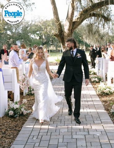 <p>Tiffany Maysonet Photography</p> Jared Kelderman and Kristi Ford at their wedding ceremony