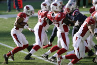 Arizona Cardinals running back Kenyan Drake, left, follows the blocking of his offensive line for a touchdown run in the first half of an NFL football game against the New England Patriots, Sunday, Nov. 29, 2020, in Foxborough, Mass. (AP Photo/Elise Amendola)
