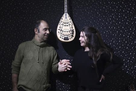 Greek Cypriot Larkos Larkou, 43, and Turkish Cypriot Hatice Ardost, 34, married since 2014, pose for a photo after an interview with Reuters in the Kiti village, Cyprus January 29,2016. Picture taken January 29. REUTERS/Yiannis Kourtoglou