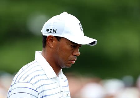 PGA golfer Tiger Woods reacts as he walks down a fairway during the second round of the 2014 PGA Championship golf tournament at Valhalla Golf Club on August 8, 2014. USA TODAY Sports/ Brian Spurlock