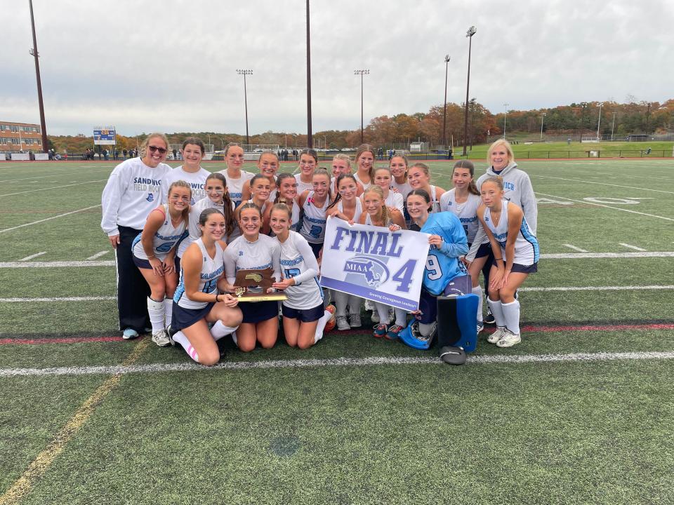 The No. 4 Sandwich Blue Knights pose with the Final Four Trophy after beating No. 5 Foxborough in overtime.