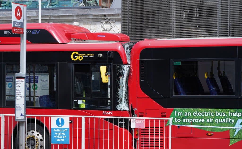 One woman was killed and three people were injured when a bus crashed into the back of another outside a major railway station (One woman was killed and three people were injured when a bus crashed into the back of another outside a major railway station/PA) (PA Wire)