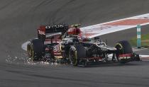 Lotus F1 Formula One driver Romain Grosjean of France takes a corner during the qualifying session of the Abu Dhabi F1 Grand Prix at the Yas Marina circuit on Yas Island, November 2, 2013. REUTERS/Steve Crisp (UNITED ARAB EMIRATES - Tags: SPORT MOTORSPORT SPORT MOTORSPORT F1)