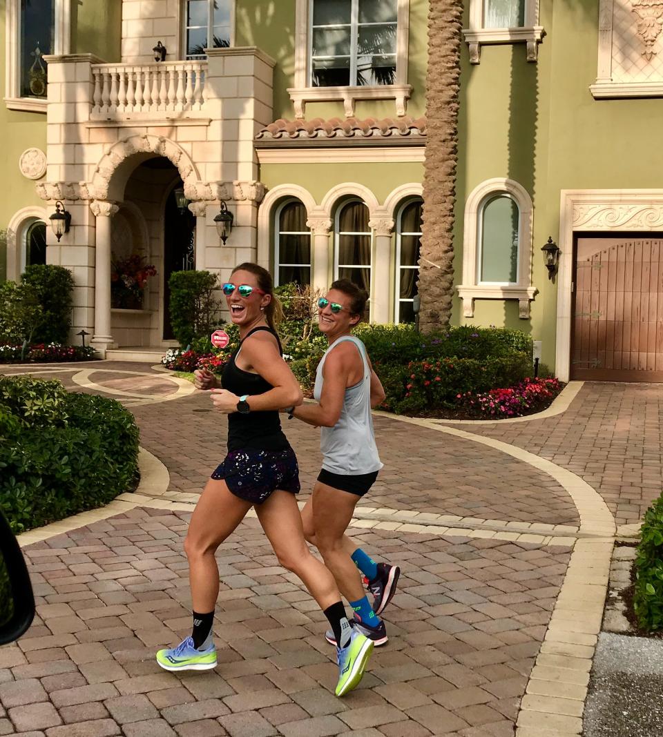 Lauren Ludka (black shirt) and Melissa Perlman during a training run in Boca Raton. Running with a partner or in a group whenever possible helps increase female runners' safety.