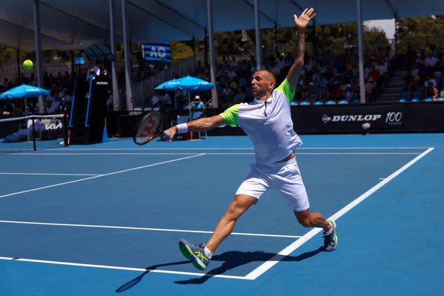 Dan Evans stretches for a backhand volley 