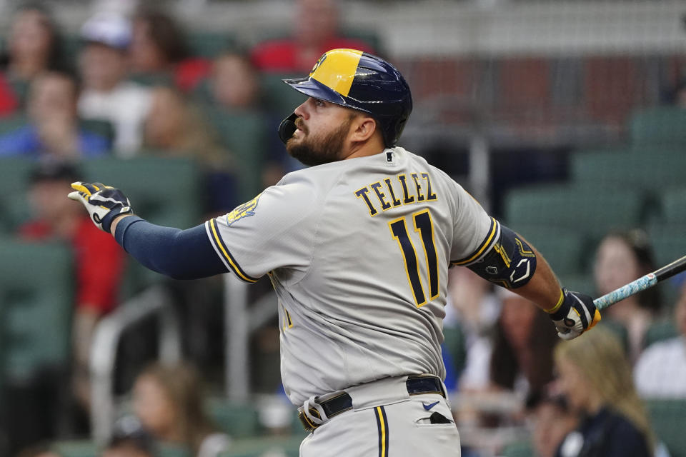 Milwaukee Brewers' Rowdy Tellez follows through on a two-run double in the first inning of a baseball game against the Atlanta Braves, Friday, May 6, 2022, in Atlanta. (AP Photo/John Bazemore)