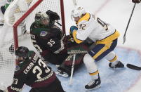 Nashville Predators' Ryan Johansen (92) crashes into Arizona Coyotes goalie Darcy Kuemper (35) during first period NHL qualifying round game action in Edmonton, on Wednesday, Aug. 5, 2020. (Jason Franson/The Canadian Press via AP)