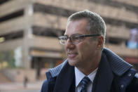 FILE - In this Nov. 19, 2014, file photo, NFL lawyer Brad Karp leaves federal court after a hearing on the proposed NFL concussion settlement, in Philadelphia. Lawyers for the NFL and retired players filed proposed changes to the $1 billion concussion settlement on Wednesday, Oct. 20, 2021, to remove race-norming in dementia testing, which made it more difficult for Black players to qualify for payments. (AP Photo/Matt Rourke, File)