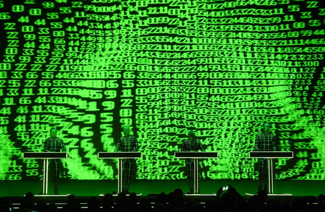 German electronic music band Kraftwerk ("power station") performs in front of a 3D video installation: ULI DECK/DPA/AFP via Getty Images