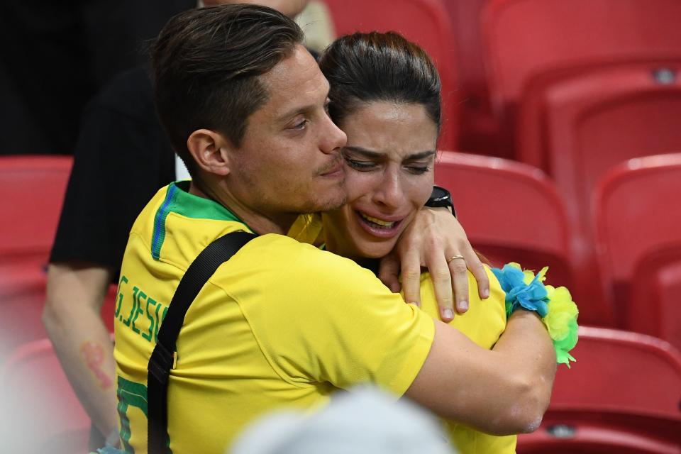 <p>Brazil fans react to their loss during the Russia 2018 World Cup quarter-final football match between Brazil and Belgium at the Kazan Arena in Kazan on July 6, 2018. – Belgium beat World Cup favourites Brazil 2-1 on Friday to set up a semi-final against France in Saint Petersburg. (Photo by Jewel SAMAD / AFP) </p>