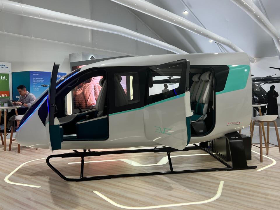 An Eve Air Mobility cabin model with the doors open