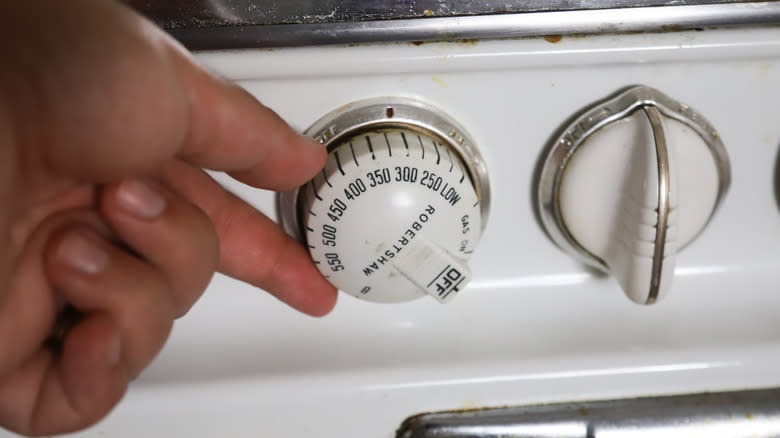 Hand turning oven dial
