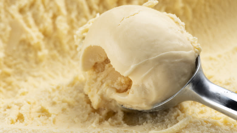 scooping vanilla ice cream