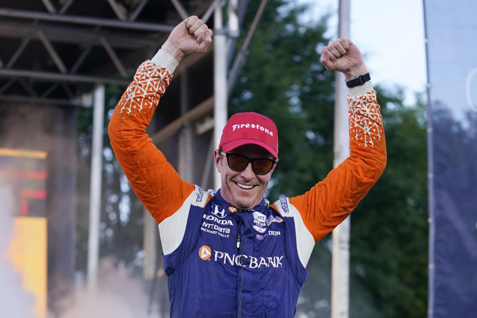 Scott Dixon celebrates after winning the Music City Grand Prix auto race Sunday, Aug. 7, 2022, in Nashville, Tenn. (AP Photo/Mark Humphrey)